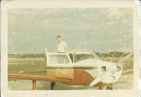 Harry Freeman with old Cessna single prop airplane